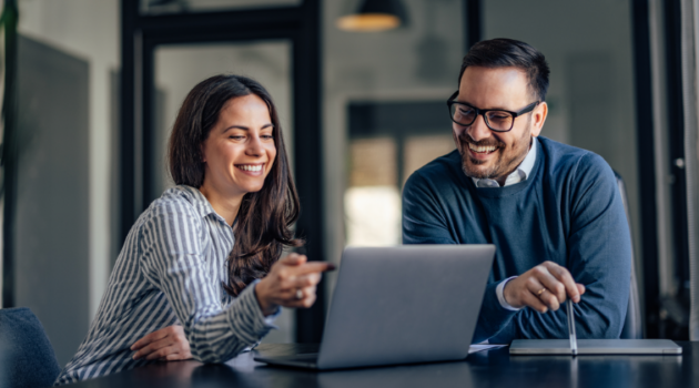 Two data scientists sitting at computer