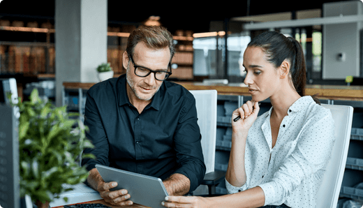 man and woman at computer