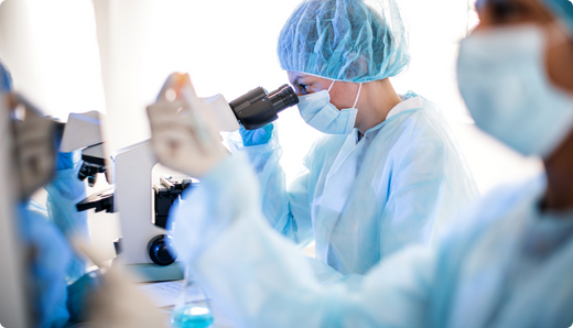 doctor looking in microscope